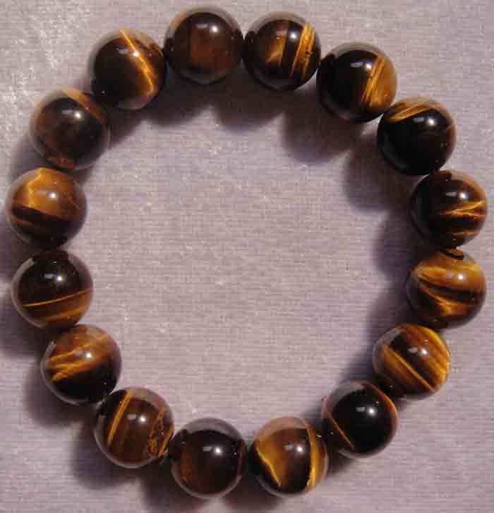 สร้อยข้อมือหินสีอัญมณี “ไทเกอร์อายส์ (Tiger eye stone)” แก้ปีชง 2558 ขนาด 13 ม.ม. สวยจริง ถูกกว่า...