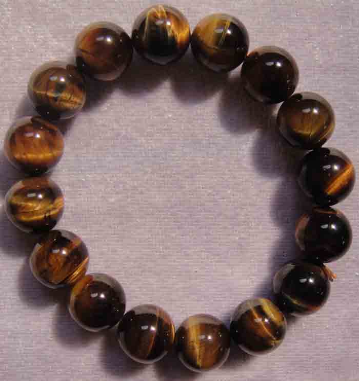 สร้อยข้อมือหินสีอัญมณี “ไทเกอร์อายส์ (Tiger eye stone)” แก้ปีชง 2558 ขนาด 13 ม.ม. สวยจริง ถูกกว่า...