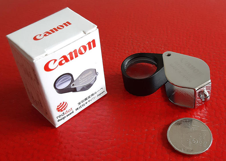 กล้องส่องพระ Canon 10X - 18 mm. Loupe ขนาดเลนส์ กว้าง 18 mm เนื้อเลนส์แก้วมัลติโค้ต -- บอดี้สีเงิน