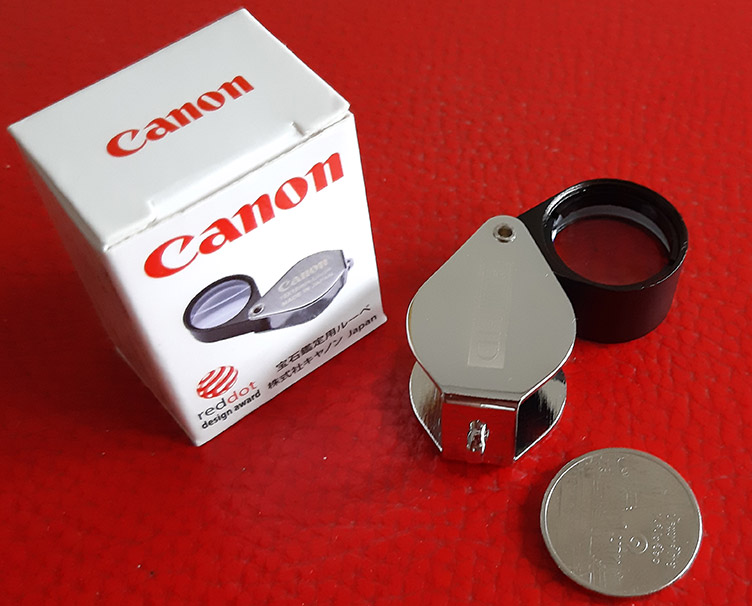 กล้องส่องพระ Canon 10X - 18 mm. Loupe ขนาดเลนส์ กว้าง 18 mm เนื้อเลนส์แก้วมัลติโค้ต -- บอดี้สีเงิน