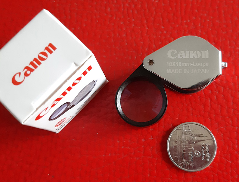 กล้องส่องพระ Canon 10X - 18 mm. Loupe ขนาดเลนส์ กว้าง 18 mm เนื้อเลนส์แก้วมัลติโค้ต -- บอดี้สีเงิน