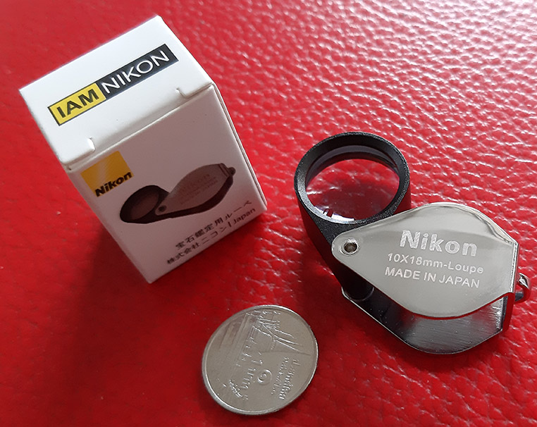 กล้องส่องพระ Nikon 10X - 18 mm. Loupe ขนาดเลนส์ กว้าง 18 mm เนื้อเลนส์แก้วมัลติโค้ต - บอดี้สีเงิน