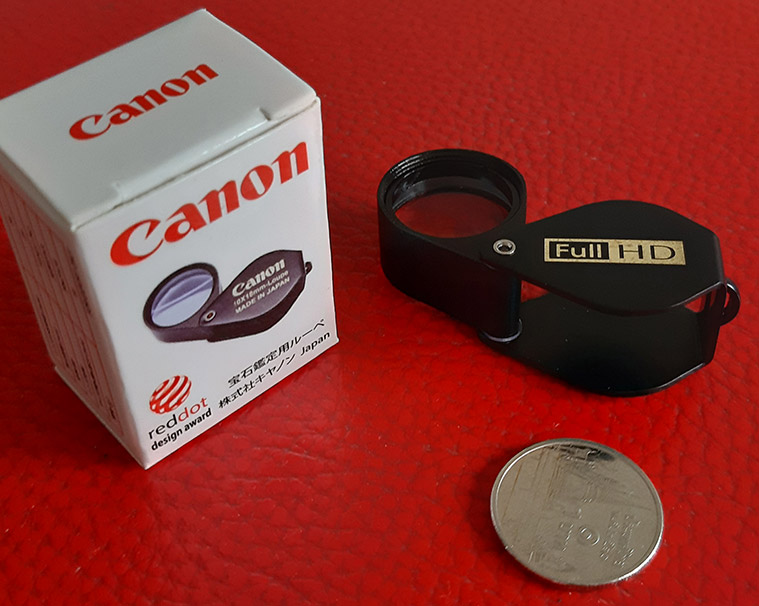 กล้องส่องพระ Canon 10X - 18 mm. Loupe ขนาดเลนส์ กว้าง 18 mm เนื้อเลนส์แก้วมัลติโค้ต - บอดี้สีดำ